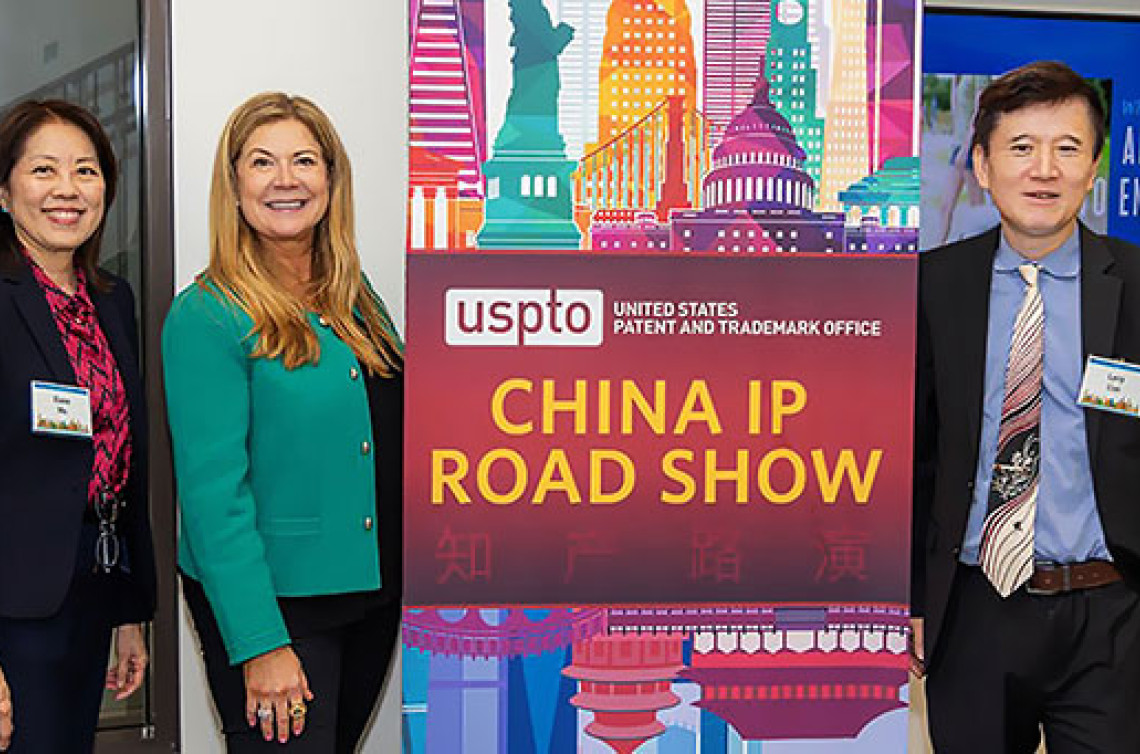 Director Vidal poses with two local entrepreneur and business owners at China IP roadshow event