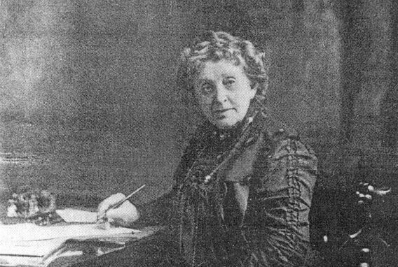 Image: Portrait of Josephine Cochran in middle age, seated at a desk.