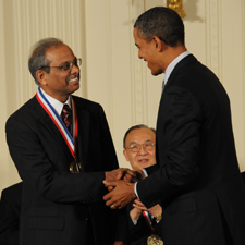 Rakesh Agrawal shakes hand with President Barack Obama