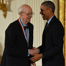 Charles W. Bachman shakes hands with President Barack Obama