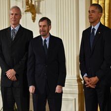Douglas Lowy and John Schiller pose with President Barack Obama