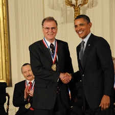 Michael F. Tompsett shakes hands with President Barack Obama