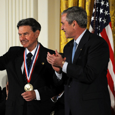 Aarmand V. Feigenbaum stands beside President George W. Bush