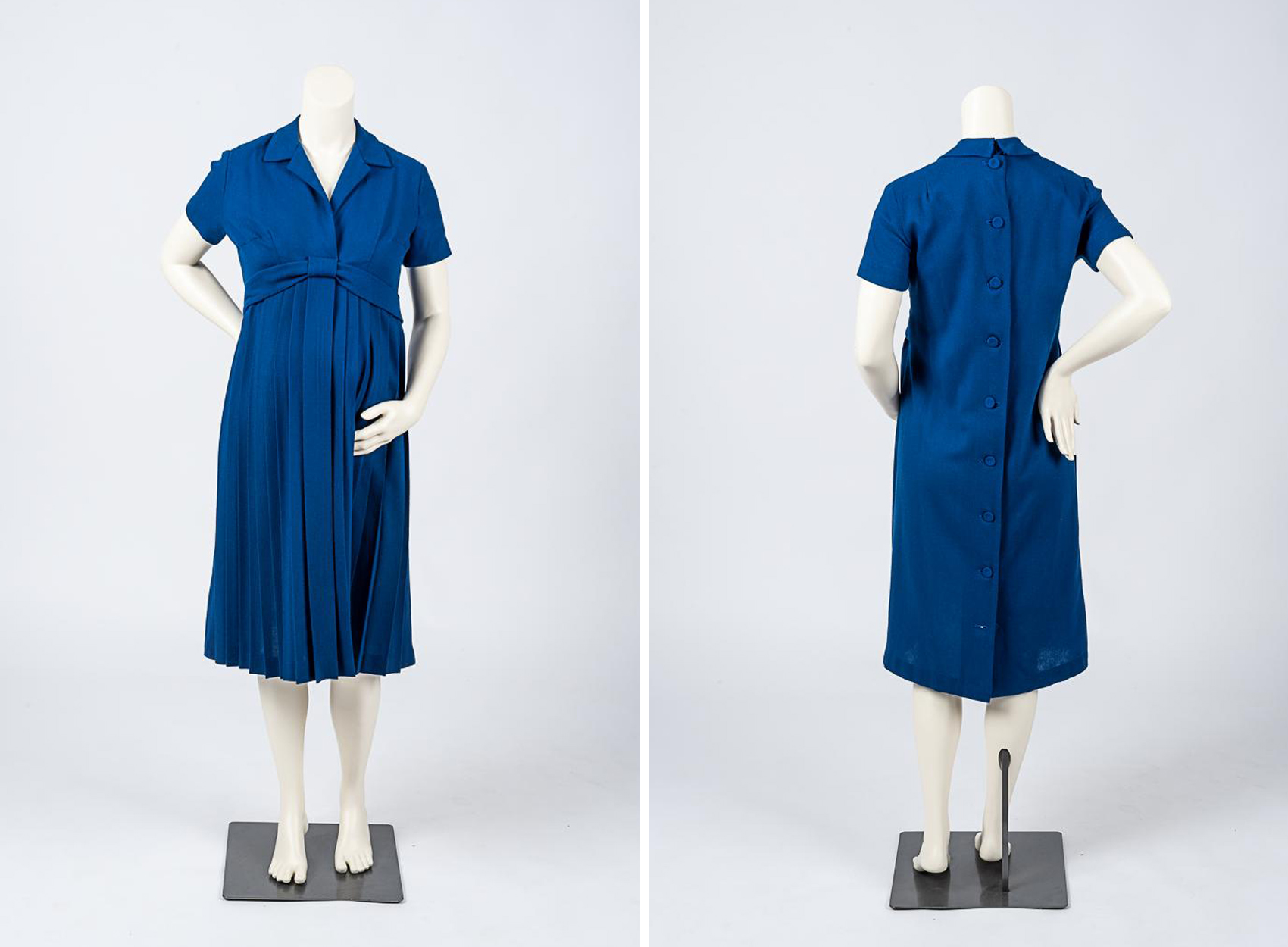 The front and rear view of a mannequin wearing an elegant maternity dress of blue wool