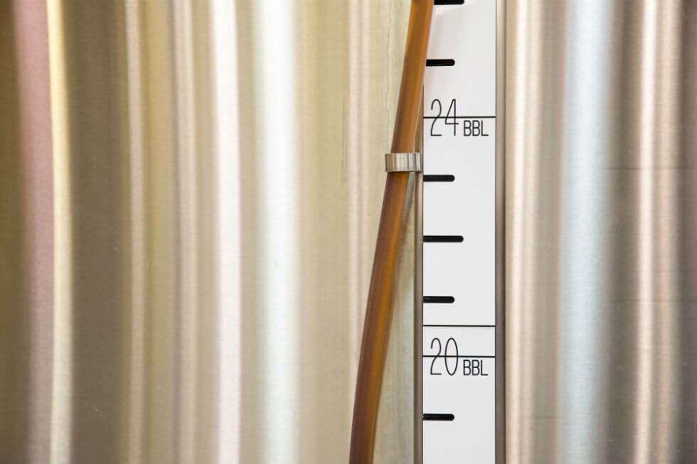 Image: Volume measures on a fermentation tank.
