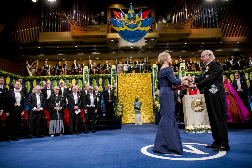 Image: Frances Arnold receives her Nobel Prize from H.M. King Carl XVI Gustaf of Sweden at the Stockholm Concert Hall. 