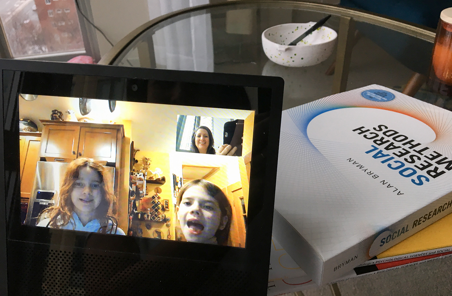Susann Keohane and her two daughters using computer video chat to stay connected while she travels for work.
