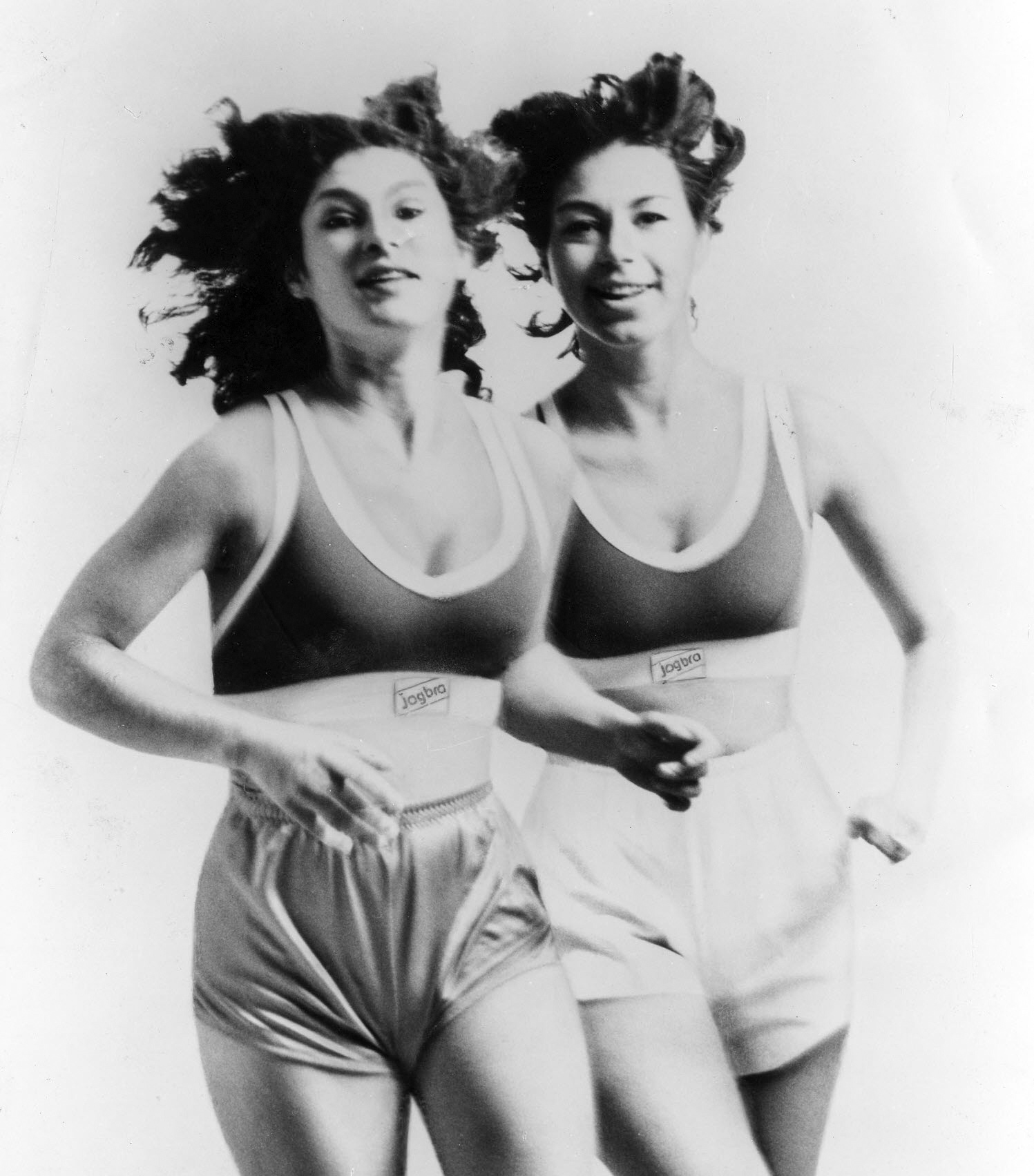  Photo ad of young Hinda Miller and Lisa Lindahl running in their Jogbras.
