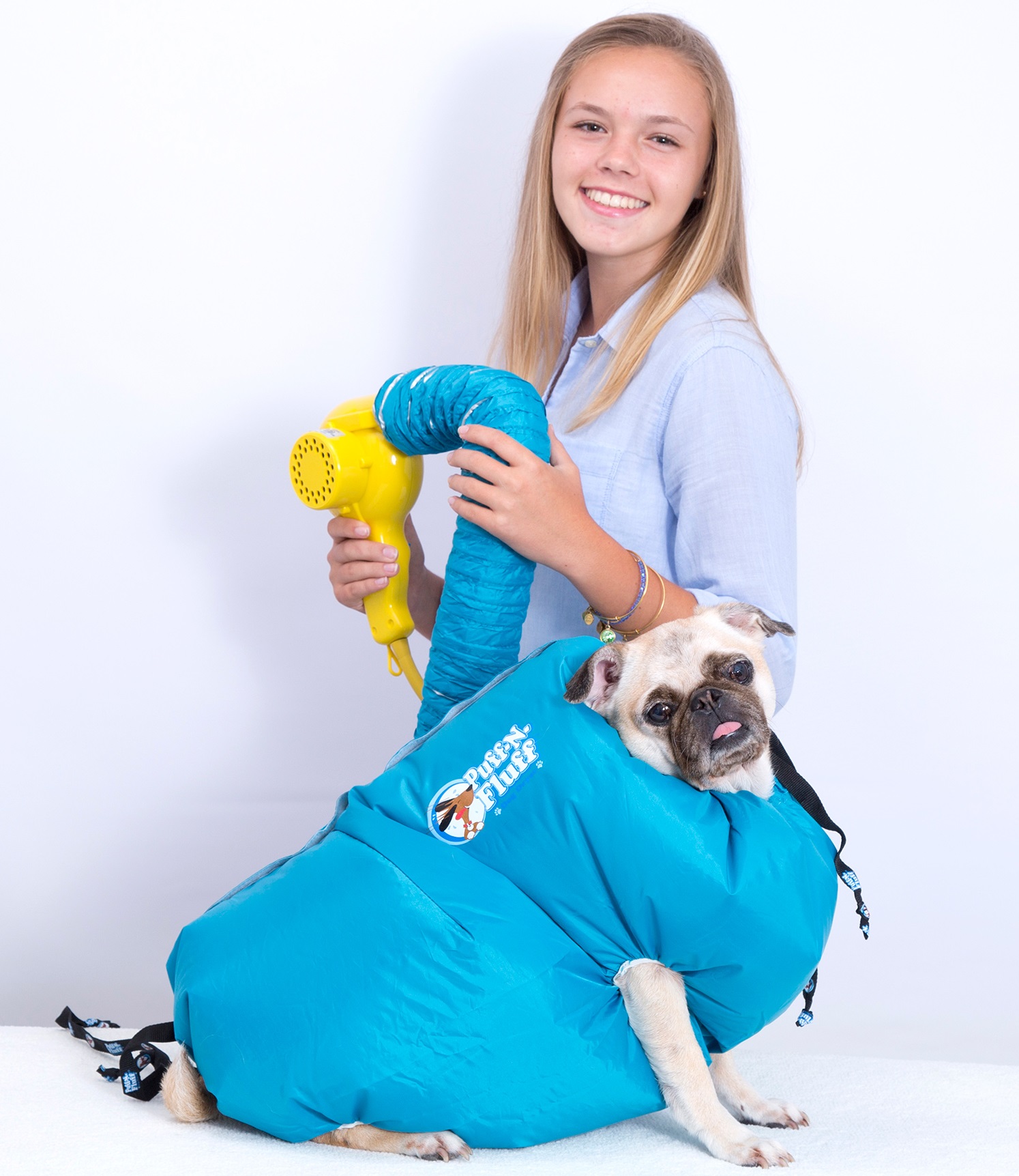 Marissa Streng poses with her dog, who models the Puff-N-Fluff dog dryer.