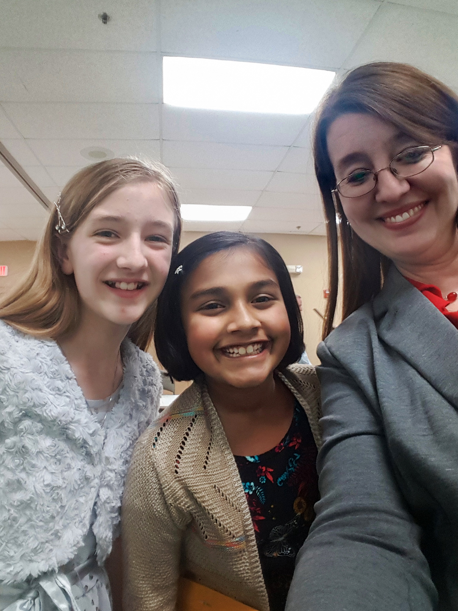 Jennifer Hartsell Stockdale, her daughter Lauren, and 4th grade Gtianjali Rao a 4H banquet