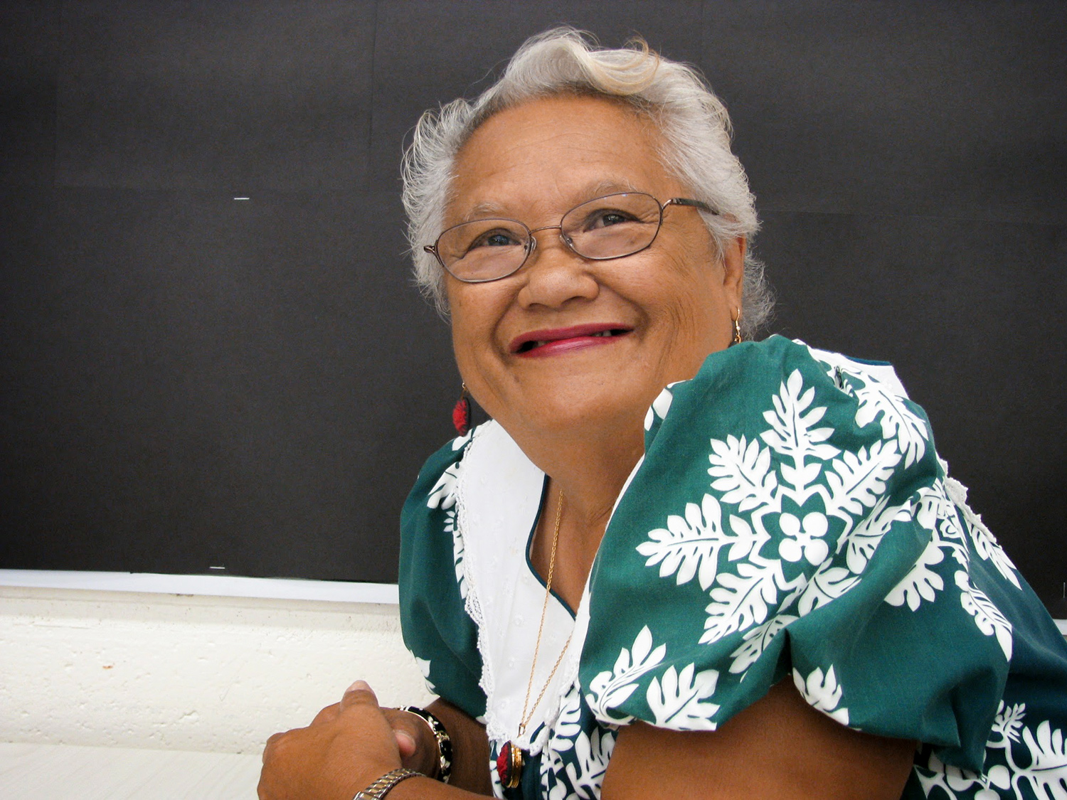 a head and shoulders photograph of a woman smiling. 