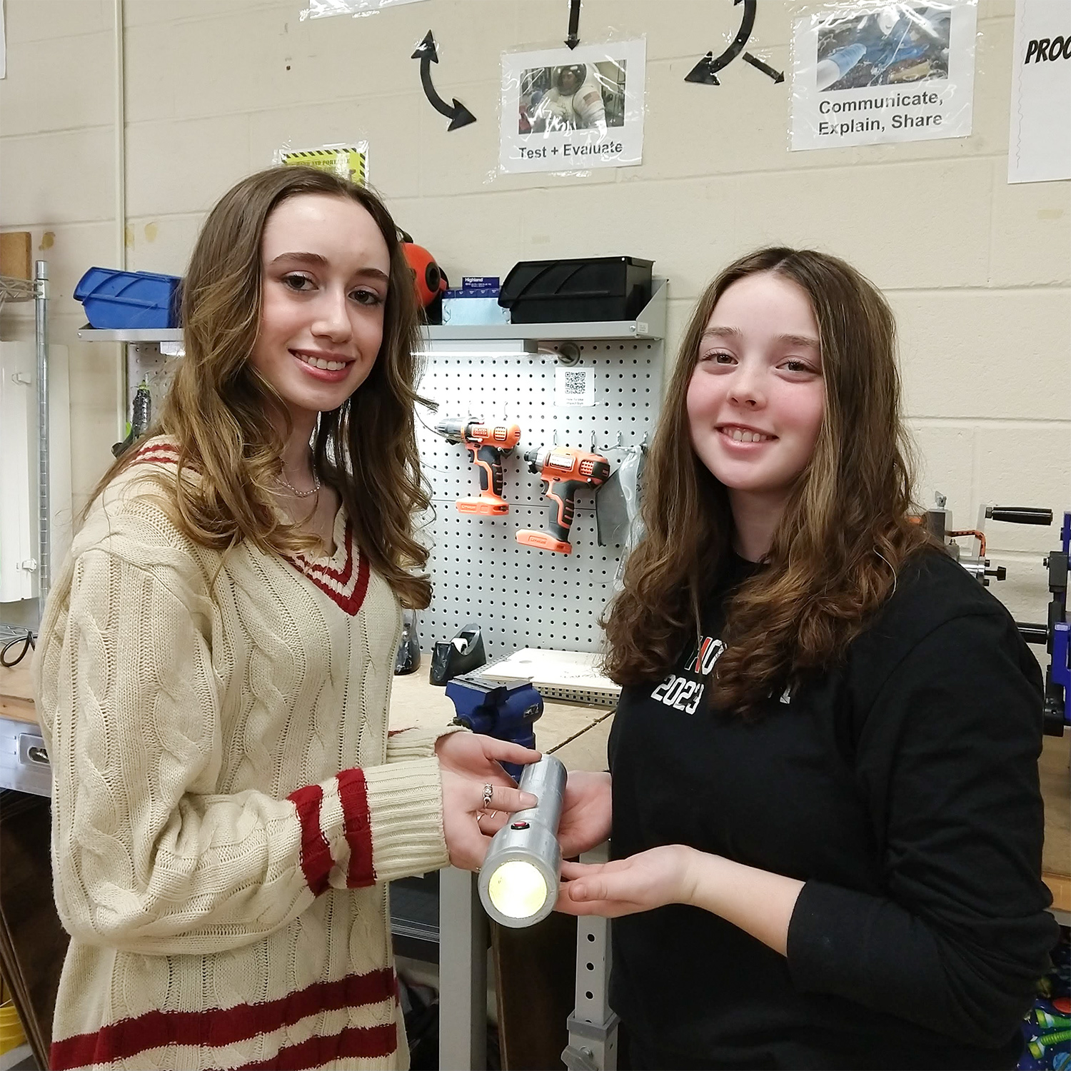 Lauren Strechay and Nicolette Buonora with their invention, the Battery Swap flashlight.