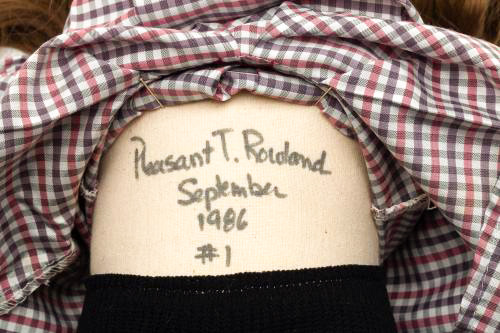 Detail of photograph showing the cloth torso of an original 1986 Samantha Parkington doll. The body of the doll is hand lettered in thick black marker by Pleasant Rowland with the words “Pleasant T. Rowland, September 1986, #1”
