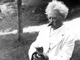 Author and humorist Samuel L. Clemens (Mark Twain) with kitten in Tuxedo Park, N.Y., circa 1907. (Photo courtesy of the Mark Twain House & Museum.)