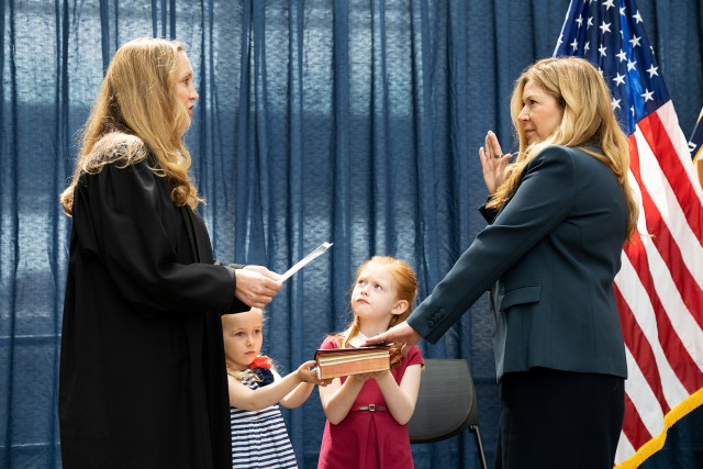 Chief Judge Kimberly A. Moore administers the oath of office to Kathi Vidal in the Madison Atrium at the headquarters of the USPTO. 