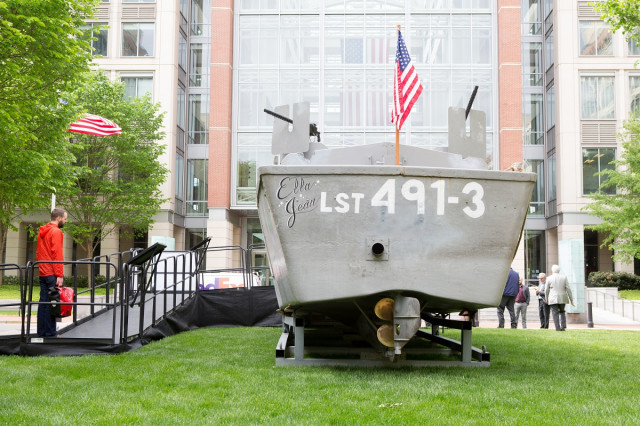 rear view of Higgins Boat in front of large USPTO glass building