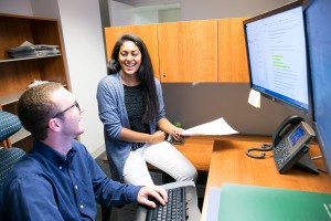 USPTO 2016 externs Nithya and Alex review an event briefing that they have been working on.