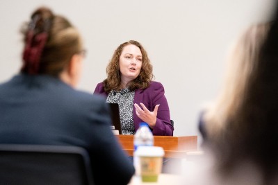 Woman speaking in front of meeting room