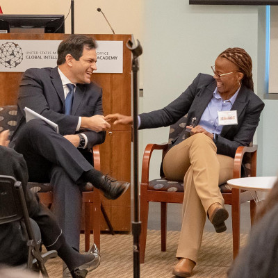 Konstantinos Georgaras, CEO of CIPO and Vivienne Katjiuongua, CEO of BIPA, smiling and shaking hands during a panel discussion.
