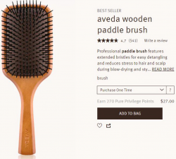 Aveda specimen shows trademark use for hairbrushes. The specimen is a screenshot of a webpage for purchasing the hairbrush. The screenshot shows trademark carved on the brush handle.