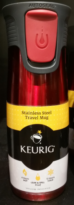 Keurig specimen shows trademark use for travel mugs. The specimen is a photograph of a travel mug with an attached label. The trademark is shown prominently in the center of the label. 