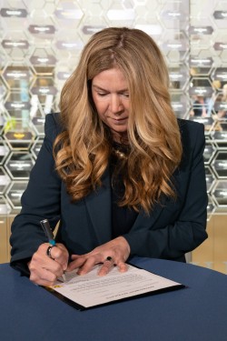 Kathi Vidal signs her name to her appointment affidavits document