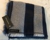 : black and white scarf with black colored tag with logo Handsel Monday attached to scarf