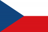  The national flag of the Czech Republic, a horizontal bicolor flag with equal bands of white and crimson red, with a royal blue, equilateral triangle at the hoist.