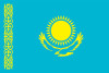 Kazakhstan flag; turquoise flag with gold sun and rays above soaring golden eagle
